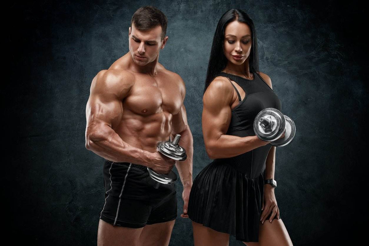 Muscular man and woman lifting dumbbells demonstrating strength and energy for pre-workout booster comparison