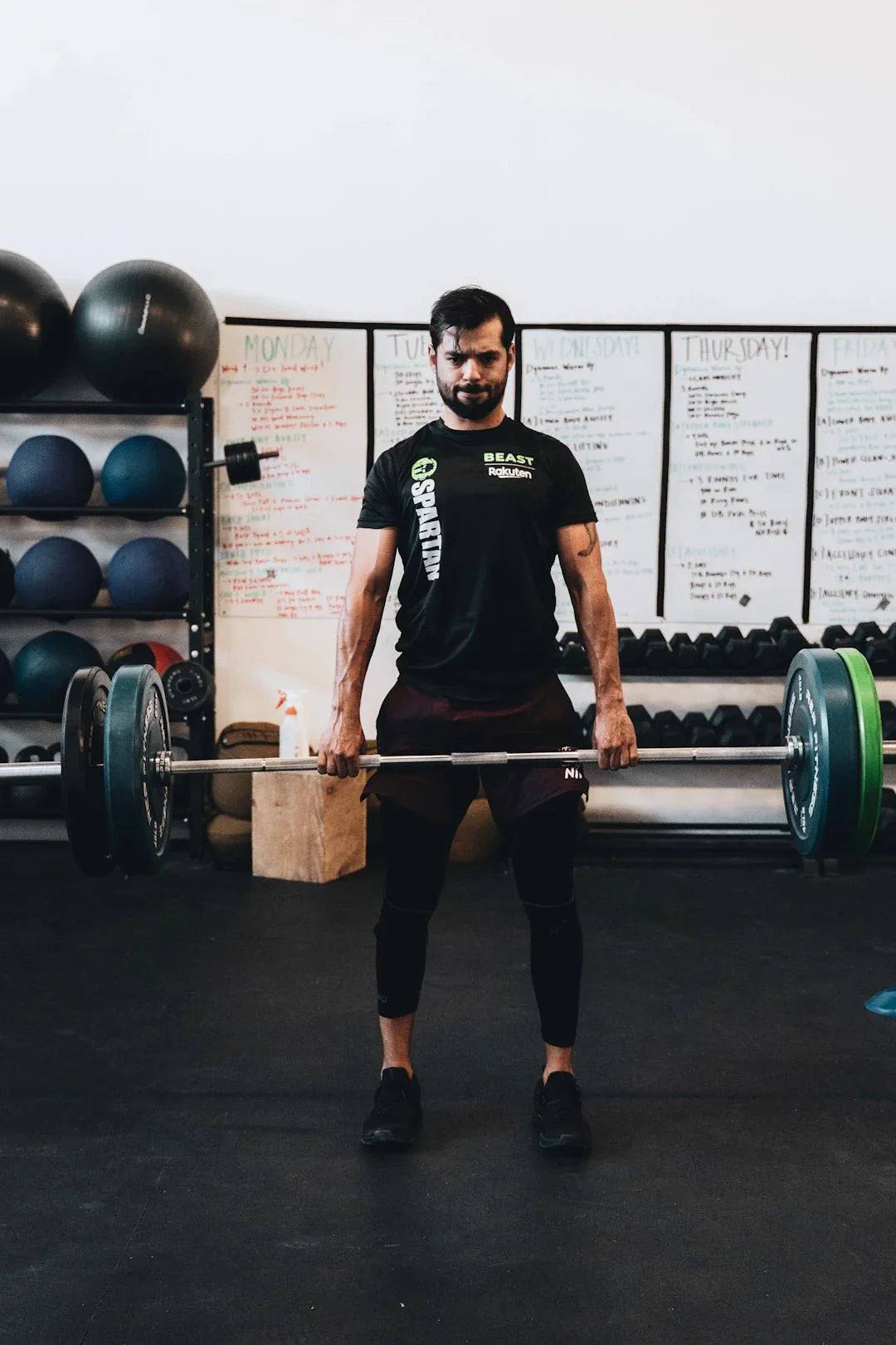 Athlete lifting a barbell in a gym focusing on personalized nutrition and sports performance trends